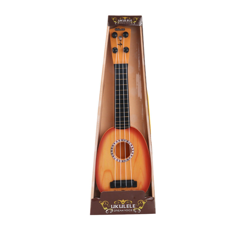 Child playing with simulation ukulele toy