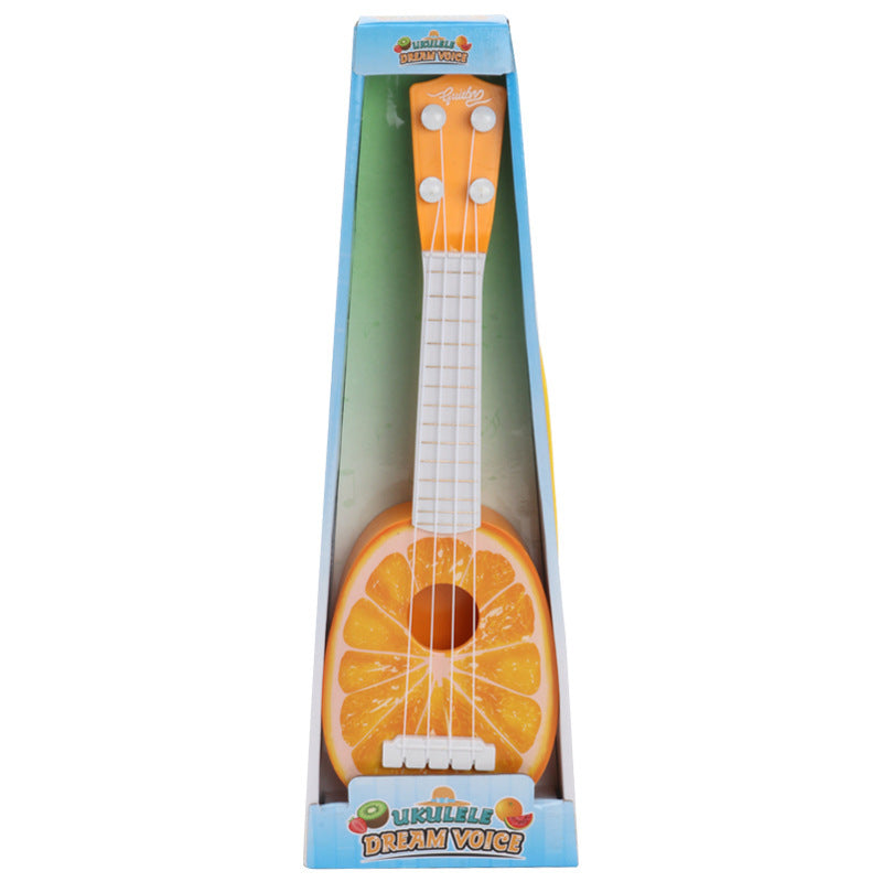 Toy guitar shaped like an orange in its packaging with 'Dream Voice' branding.