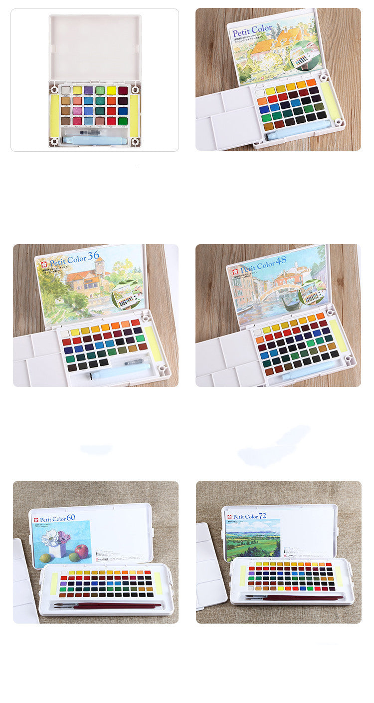 Color swatch books on a wooden surface
