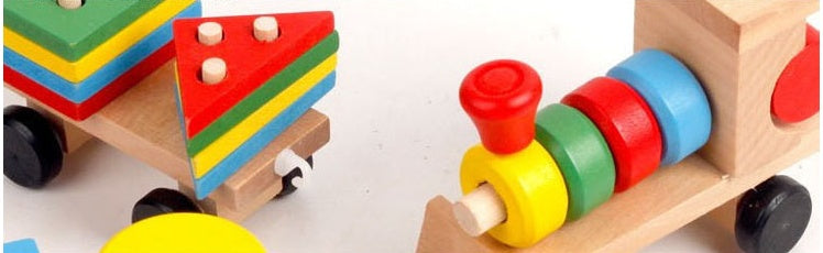 Colorful wooden toy train and car set on a white background