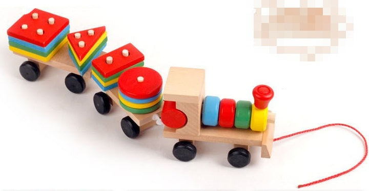 Colorful wooden toy train with various shapes on a white background
