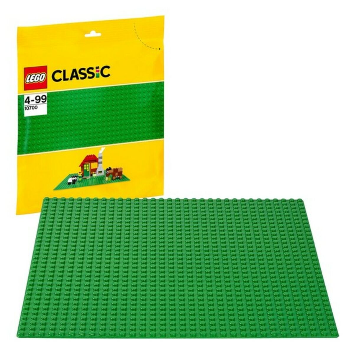 Green LEGO baseplate with packaging on a white background