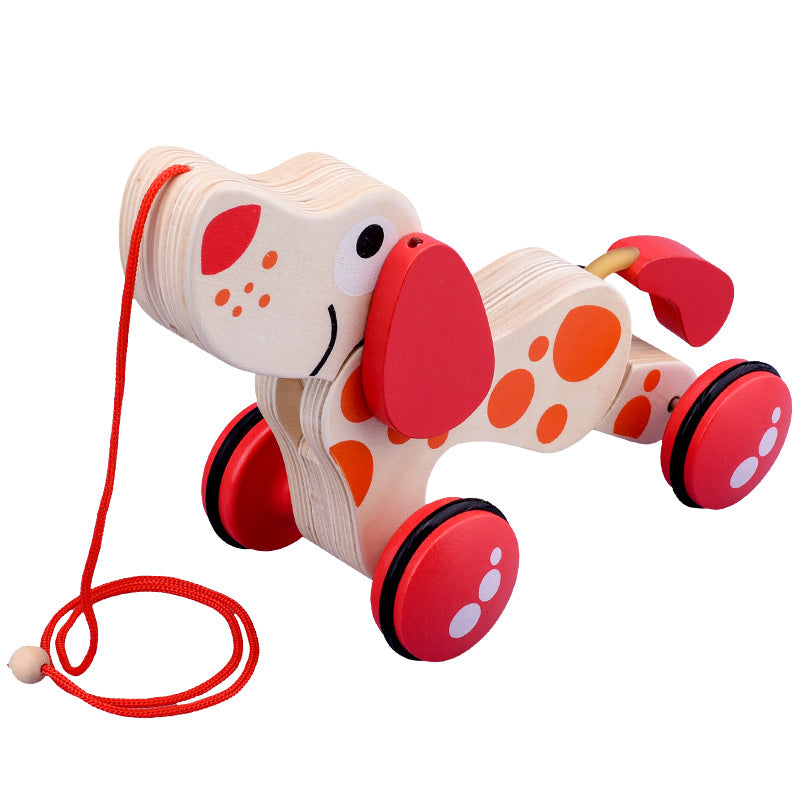 Wooden toy dog with red wheels and a string on a white background