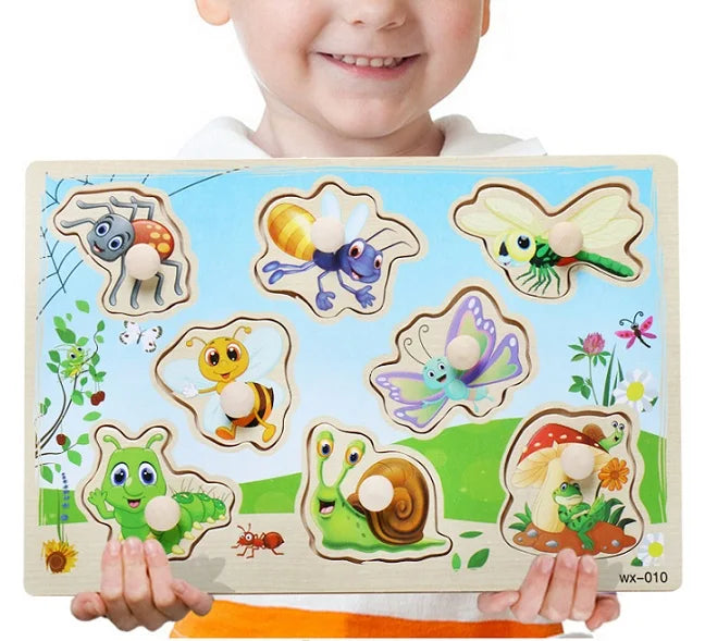 Child holding a wooden puzzle with animal illustrations on a white background