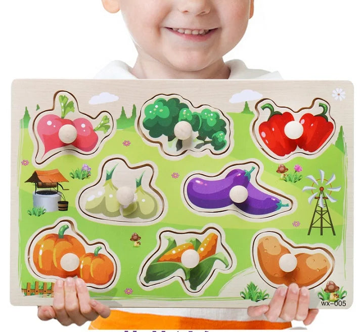 Child holding a colorful wooden puzzle with vegetable shapes