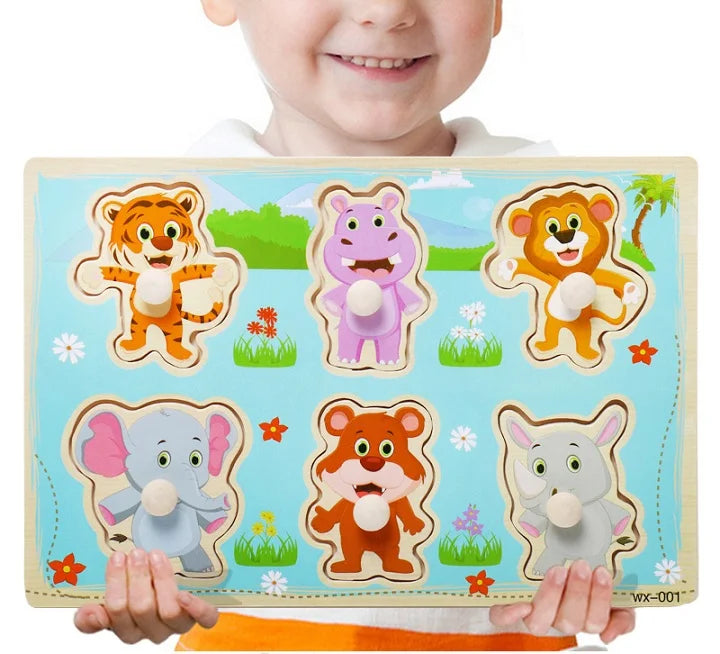 Child holding a wooden puzzle with animal figures on a white background