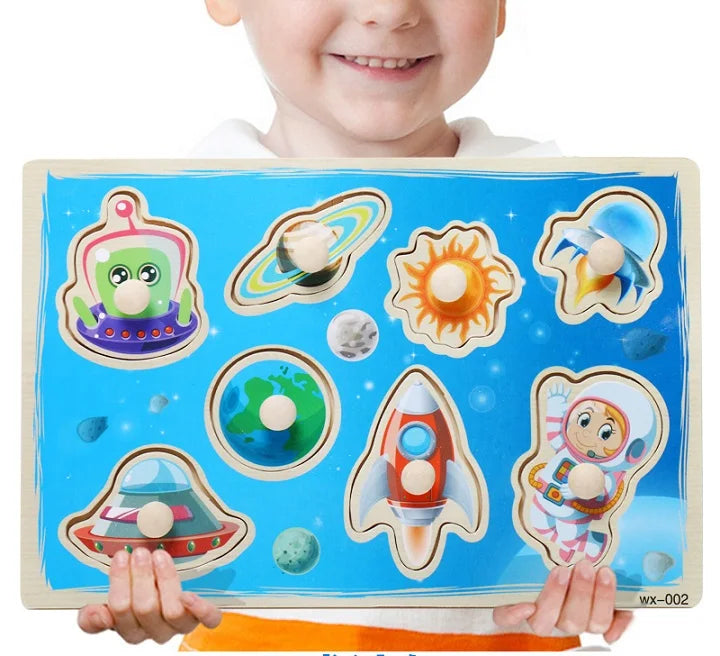 Child holding a space-themed puzzle with cartoon characters on a white background