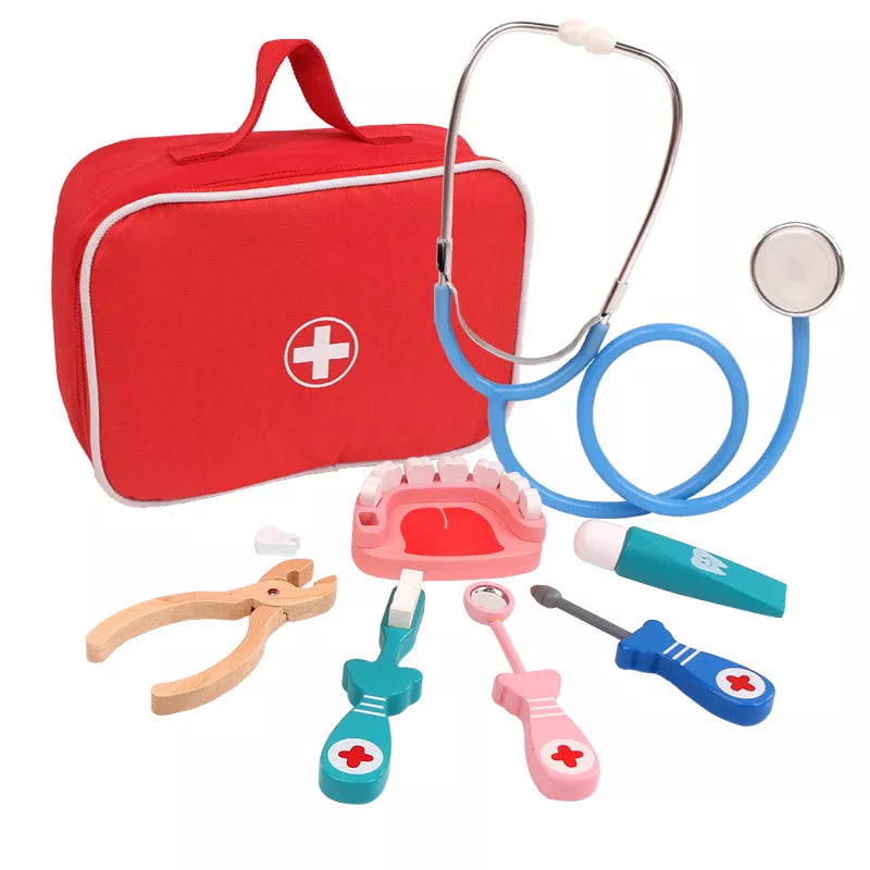 Set of toy medical tools including a stethoscope, first aid kit, and various pretend medical instruments on a white background.