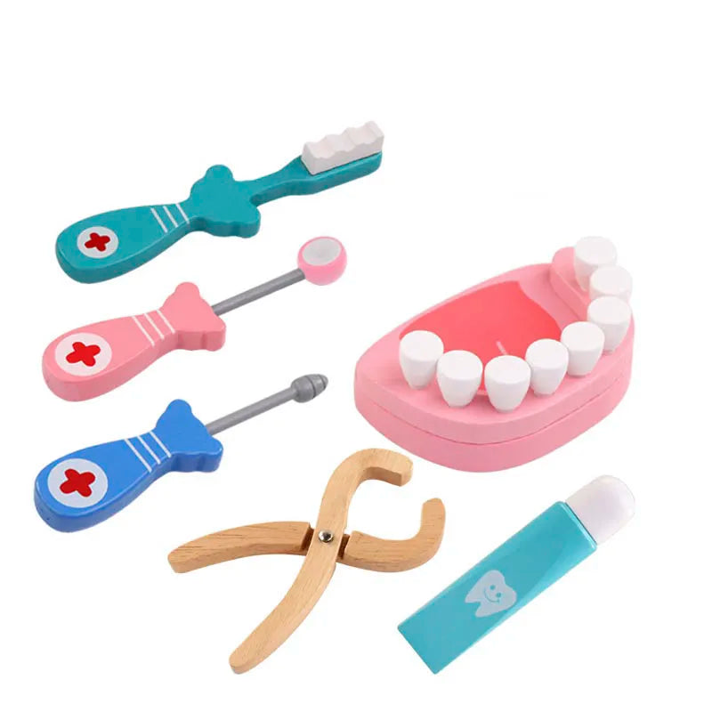 Set of toy dental tools including a toothbrush, dental mirror, and other instruments on a white background.