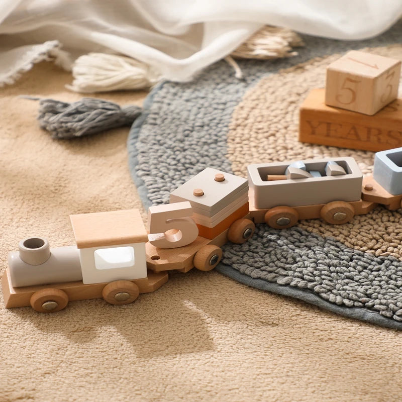 Wooden toy train on a carpeted floor with a soft focus background
