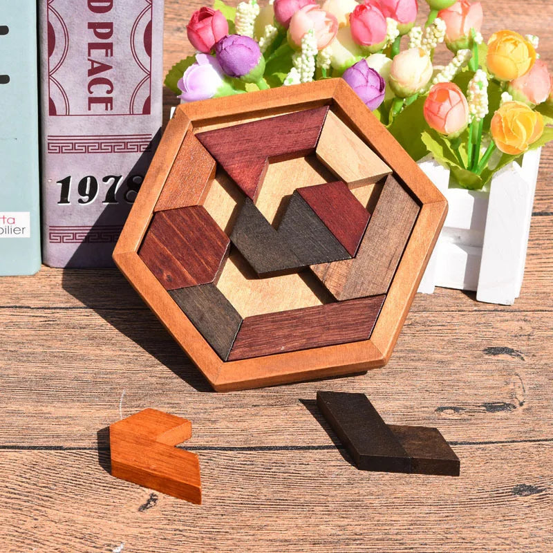 Wooden tangram puzzle on a wooden surface with flowers in the background
