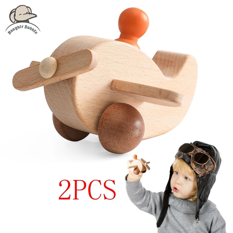 Wooden airplane toy with child wearing a pilot hat and goggles, brand 'Bamboo Baby' visible.