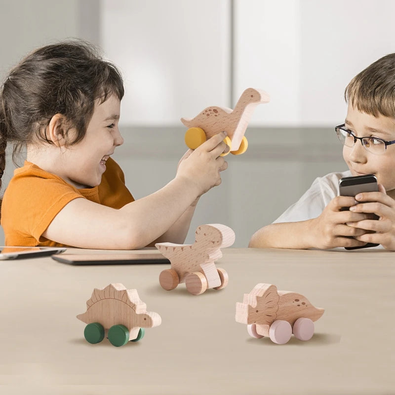 Two children playing with wooden toys on a table.