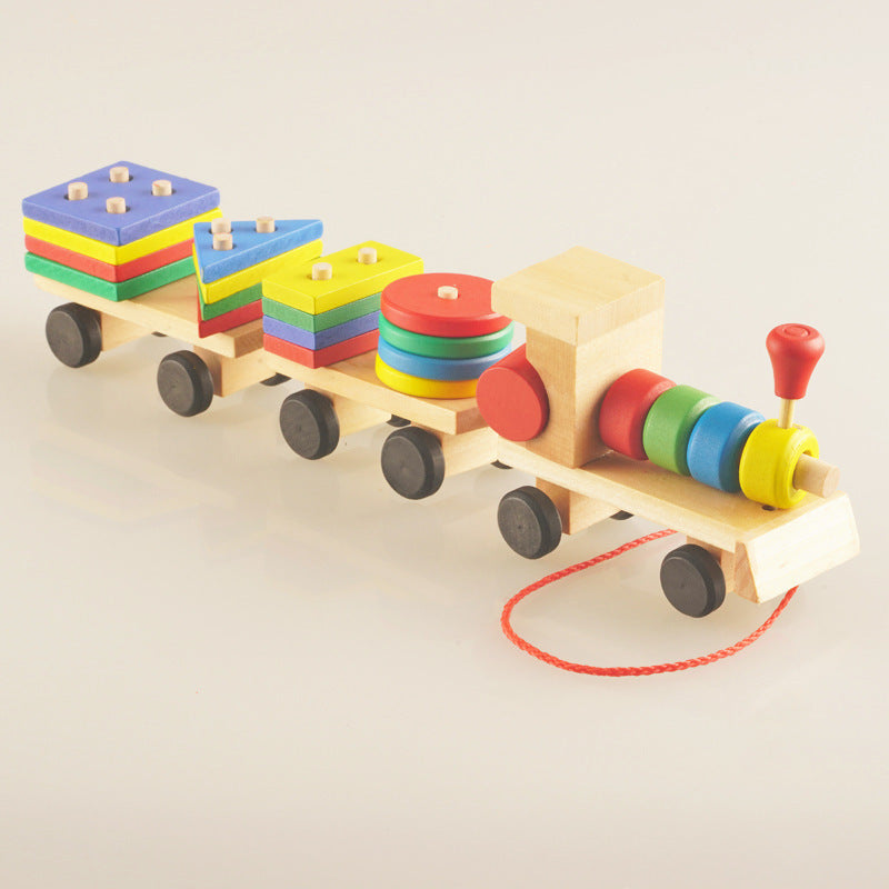 Colorful wooden train toy with geometric shapes on a beige background