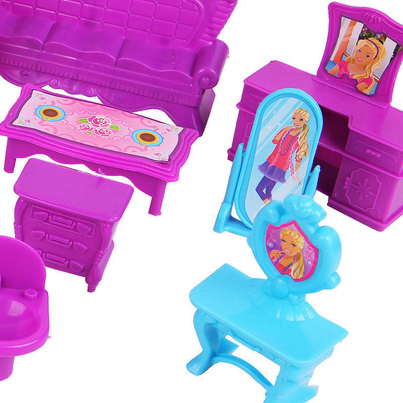 Set of toy furniture including a purple couch, table, and chairs with Barbie-themed decorations on a white background.