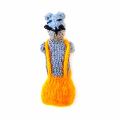 Knitted toy resembling a raccoon with an orange body on a white background