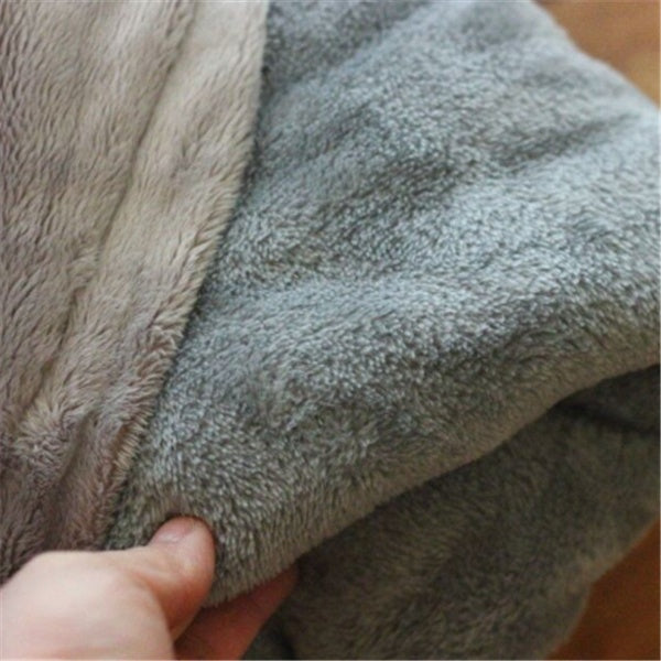Close-up of gray fleece fabric held by a hand