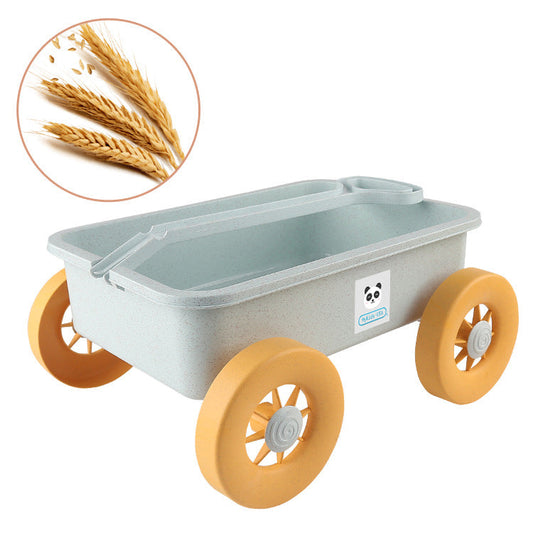Toy cart with yellow wheels and a small inset of wheat on a white background