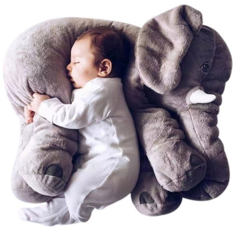 Baby sleeping on a large gray elephant-shaped pillow