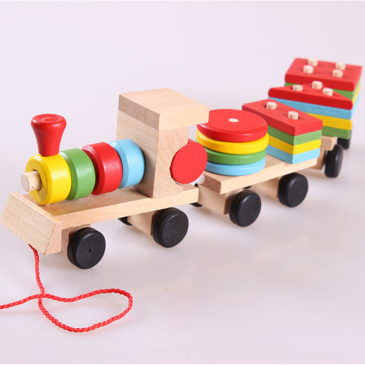 Wooden toy train with colorful carriages on a white background