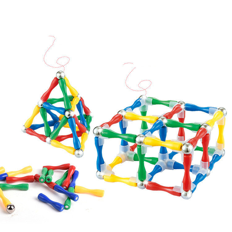 Colorful magnetic building toys on a white background