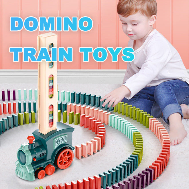 Child playing with a colorful domino train toy set on a light-colored floor.