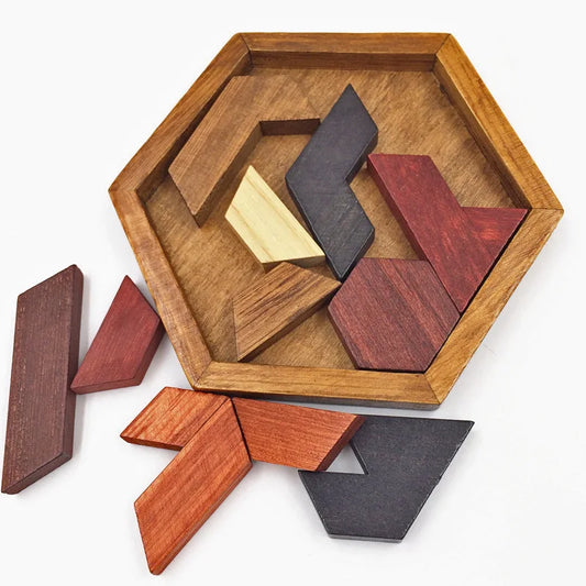 Wooden tangram puzzle with geometric shapes on a white background