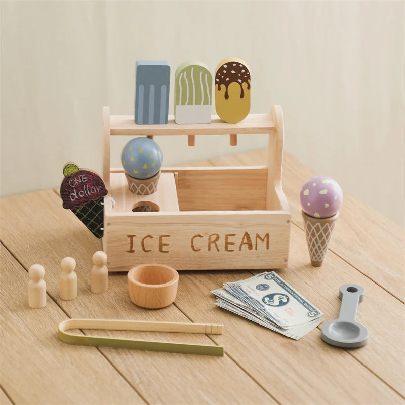 Wooden ice cream stand with toy ice cream cones and accessories on a wooden surface.