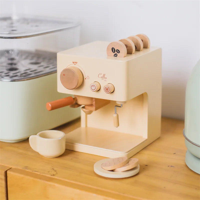 Wooden toy espresso machine on a wooden surface with a white background