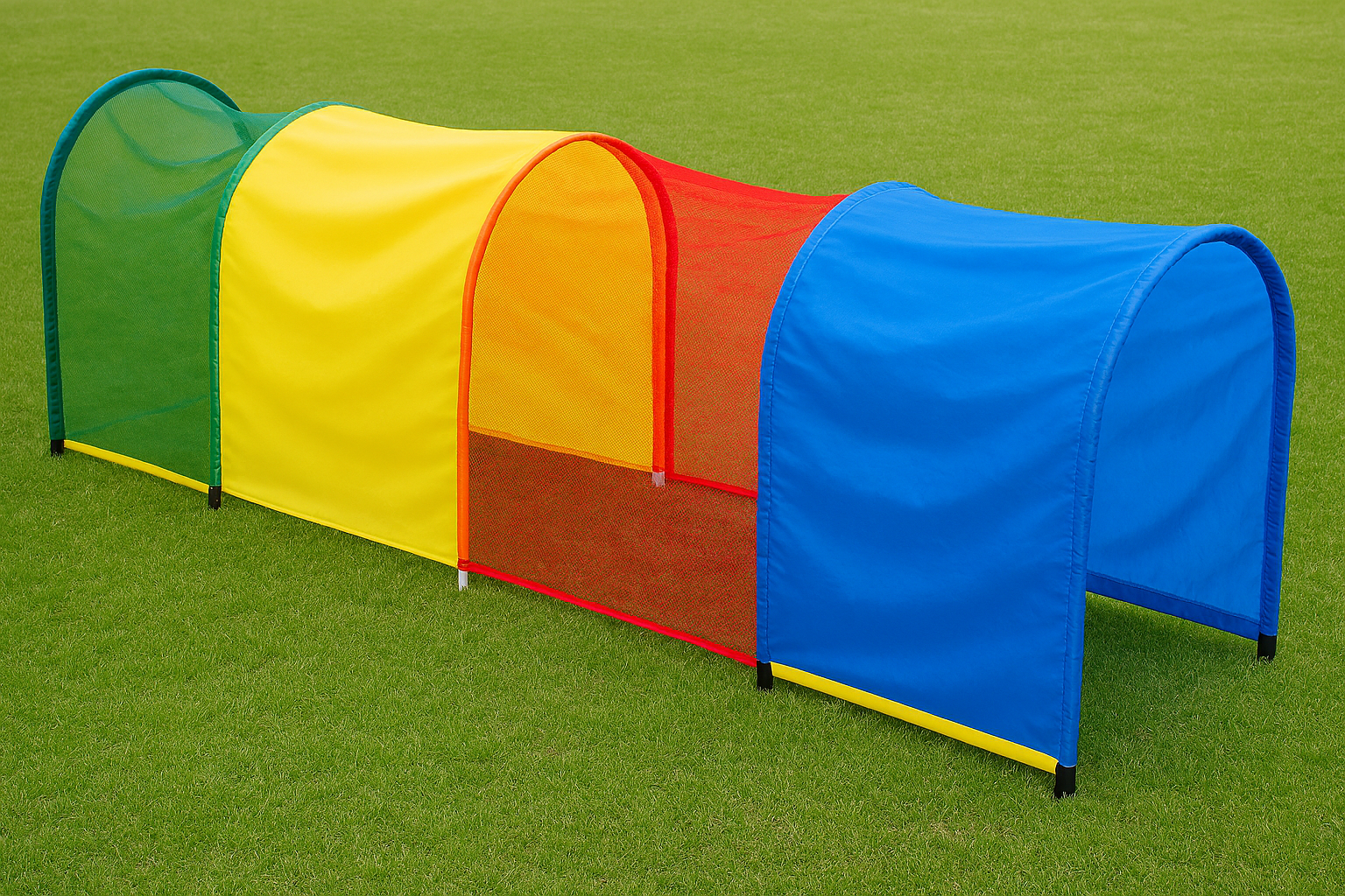 Colorful play tunnel on a green grass background