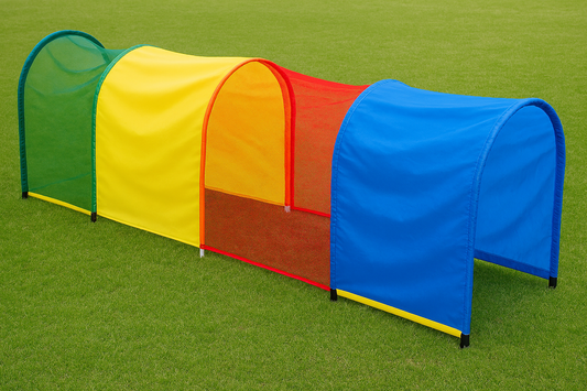 Colorful play tunnel on a green grass background