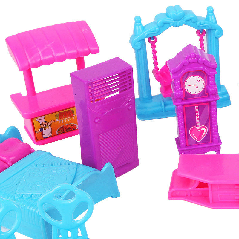 Colorful toy set with a clock tower, swing, and other structures on a white background